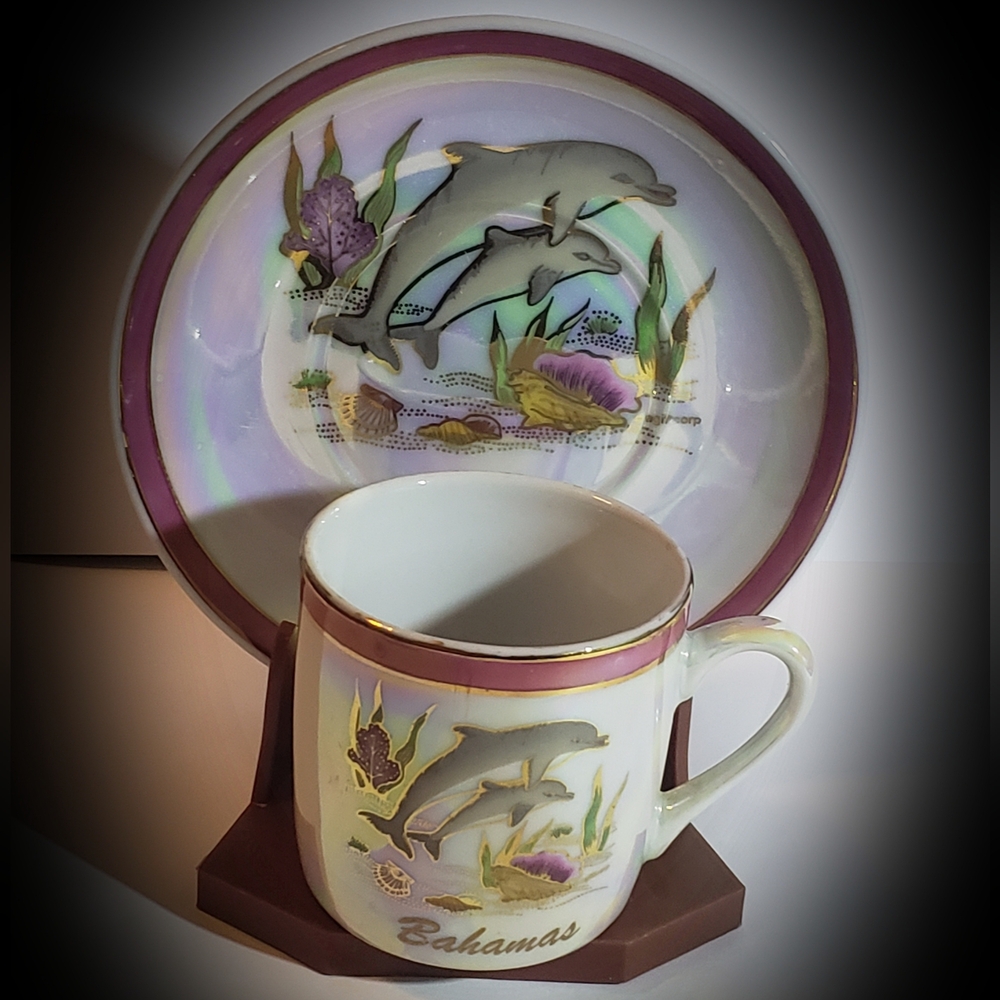 This vintage miniature cup & saucer set is a beautiful souvenir from the Bahamas